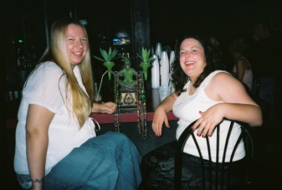 The girls at the bar haning out with the handsome primate